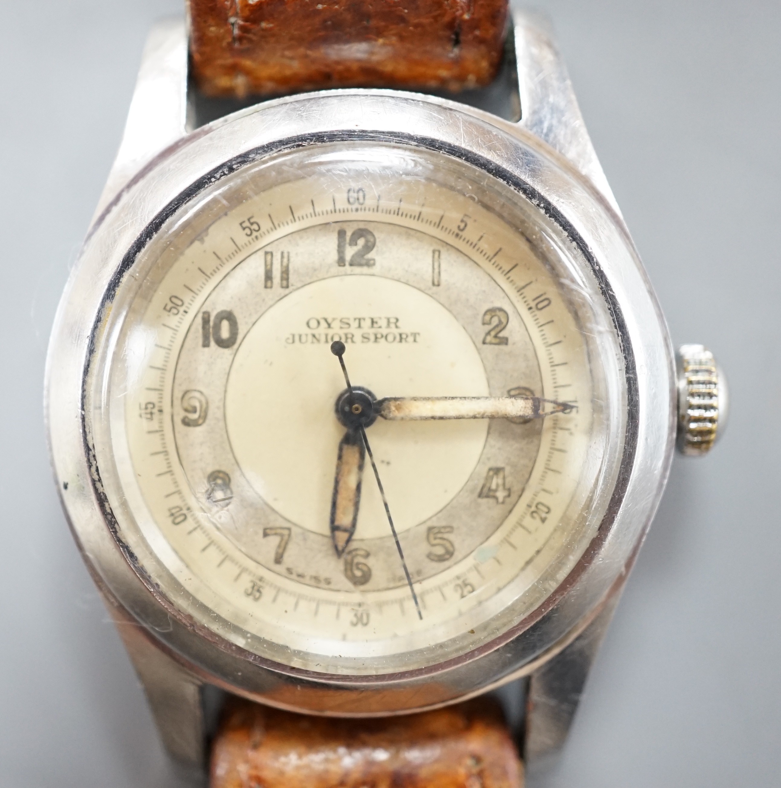 A stainless steel Tudor Oyster Junior Sport manual wind wrist watch, with Arabic dial, on associated leather strap, case diameter 32mm, case back numbered 178194.